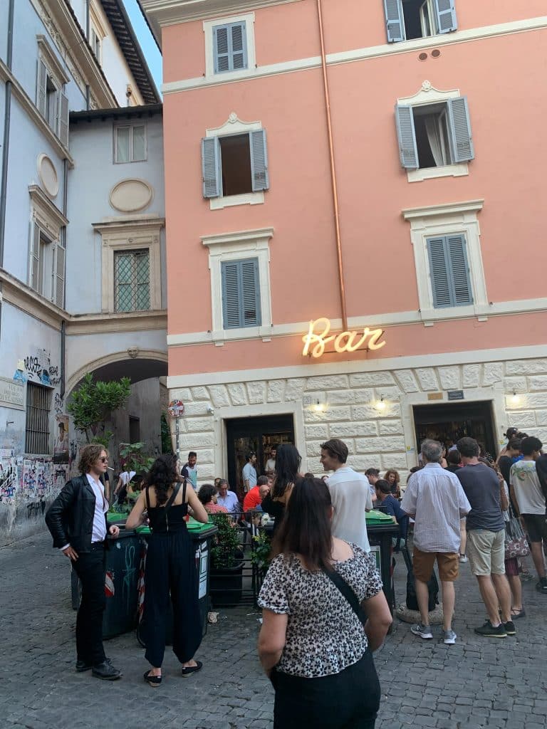 Bar in Trastevere with people outside.