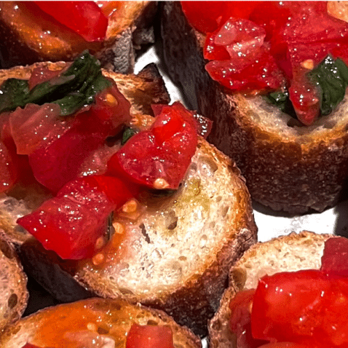 Tuscan bruschetta recipe showing close up of tomatoes on bread