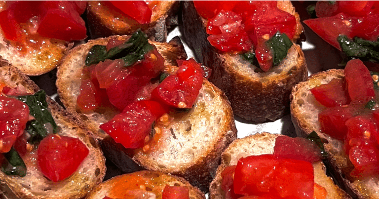 Tuscan bruschetta recipe showing close up of tomatoes on bread