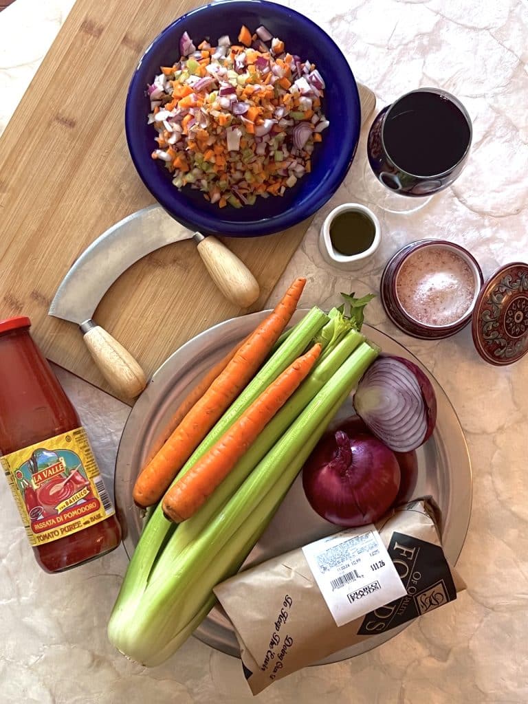 Ingredients for Tuscan Ragu: celery, carrot, red onion, ground beef, wine, tomato passata, salt.