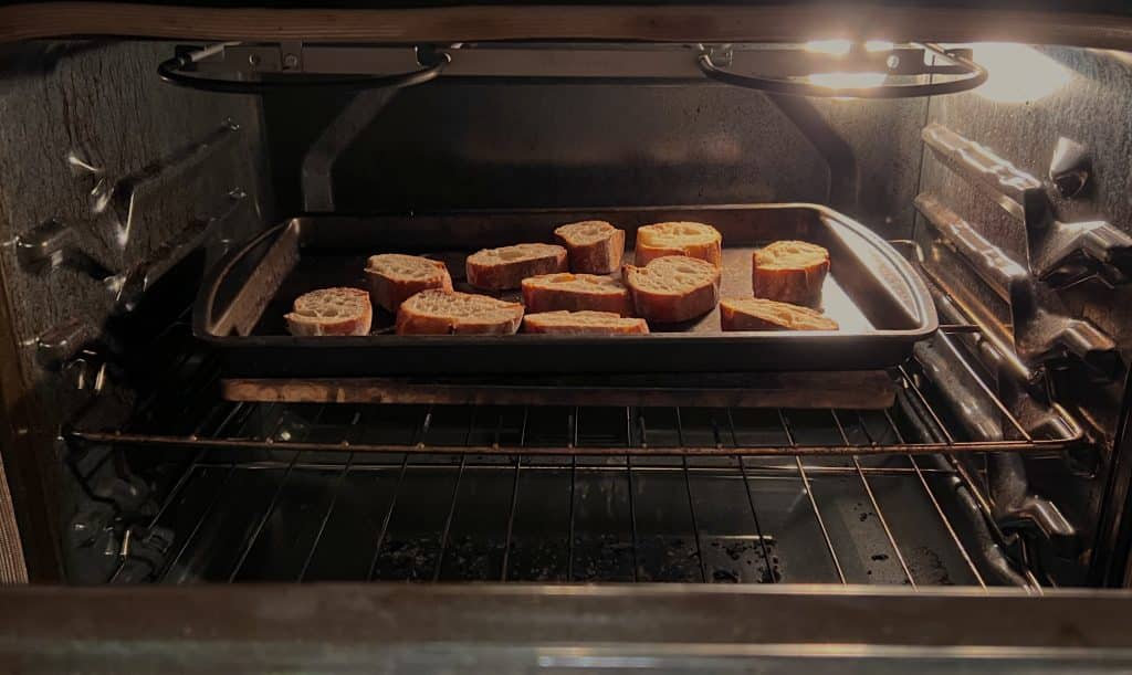 Slices of bread toasting in the oven.