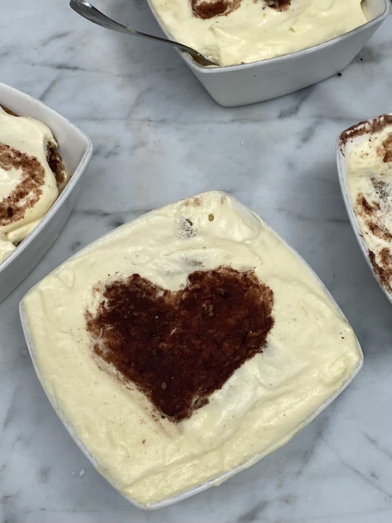 Tiramisu decorated with a chocolate heart.