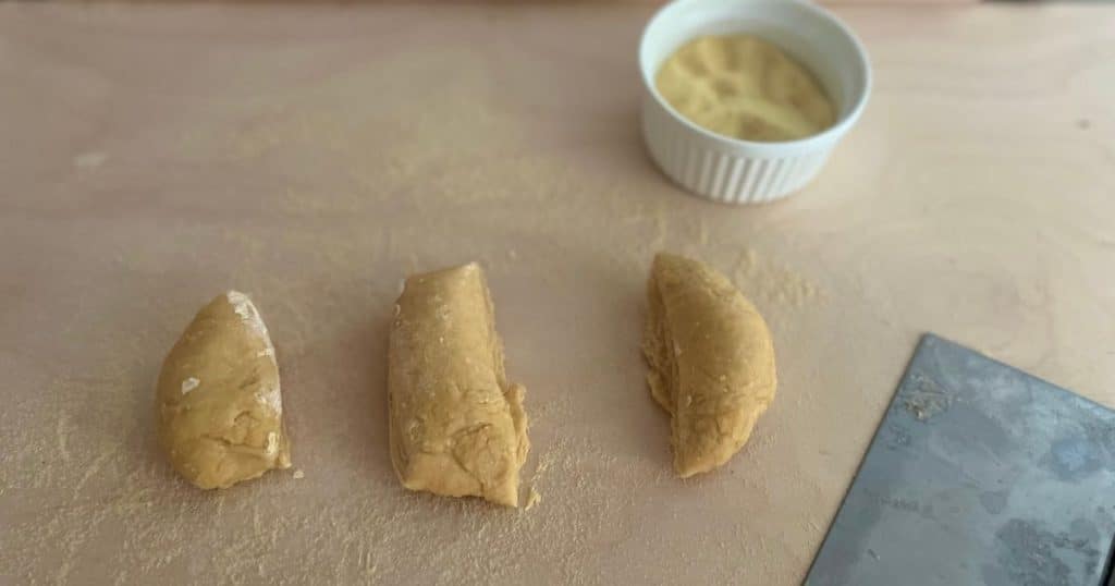 Pasta dough divided into 3 parts.