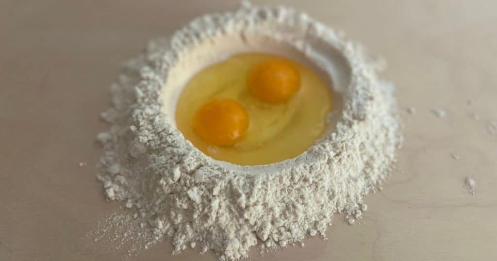 Mound of flur with two eggs in the well.